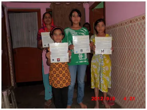 Community children showing their certificates